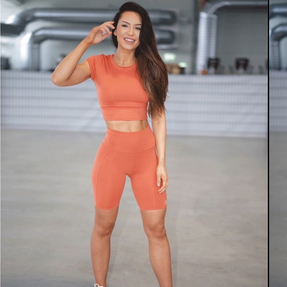 Bombshell sports wear orange biker shorts